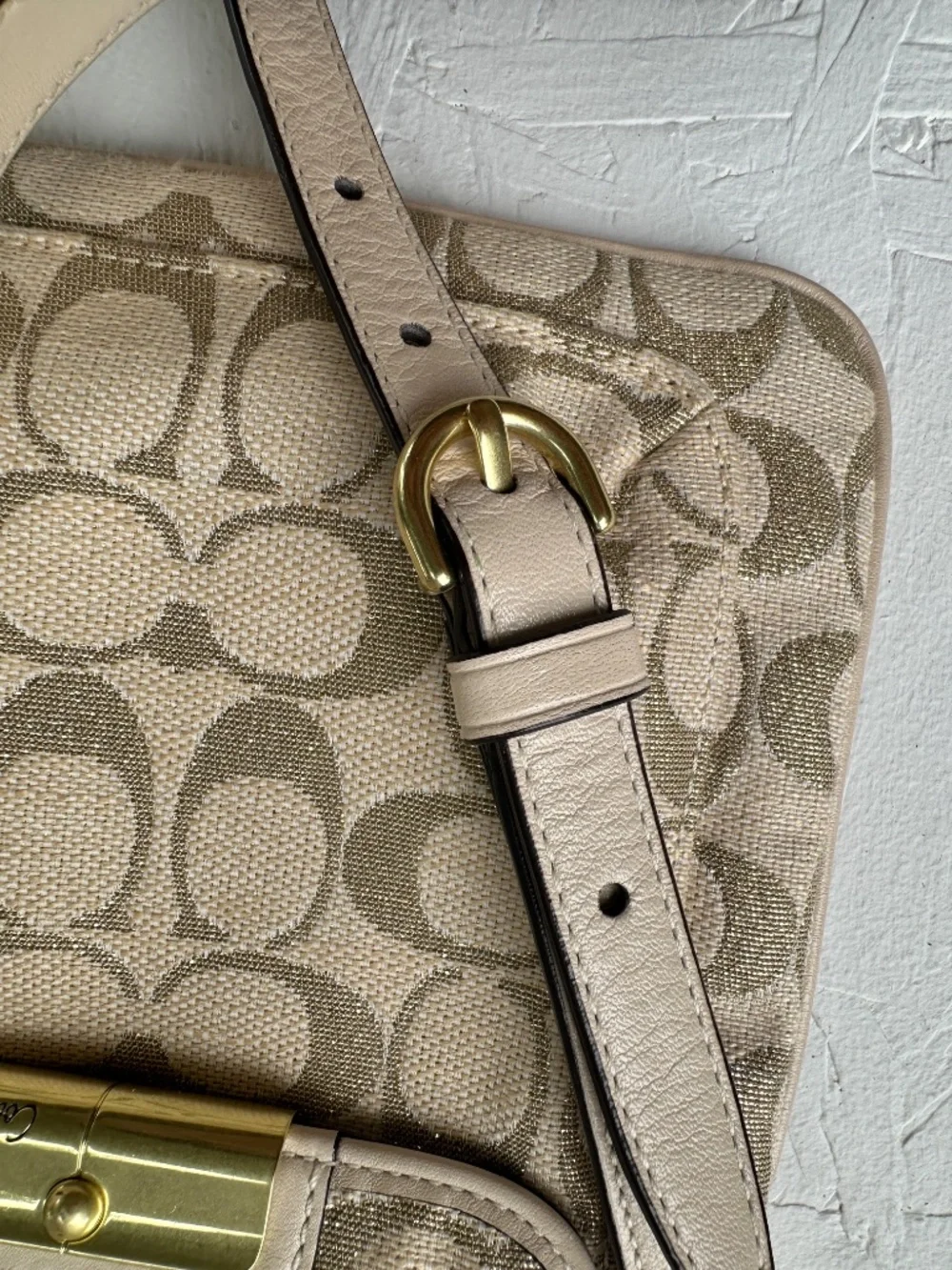 Coach Kristin Signature Crossbody Swing Bag in a metallic gold and beige fabric